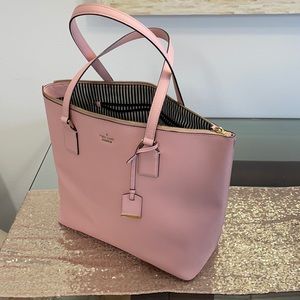 Large Kate spade barley used black and white stripes inside. Large zipper pocket